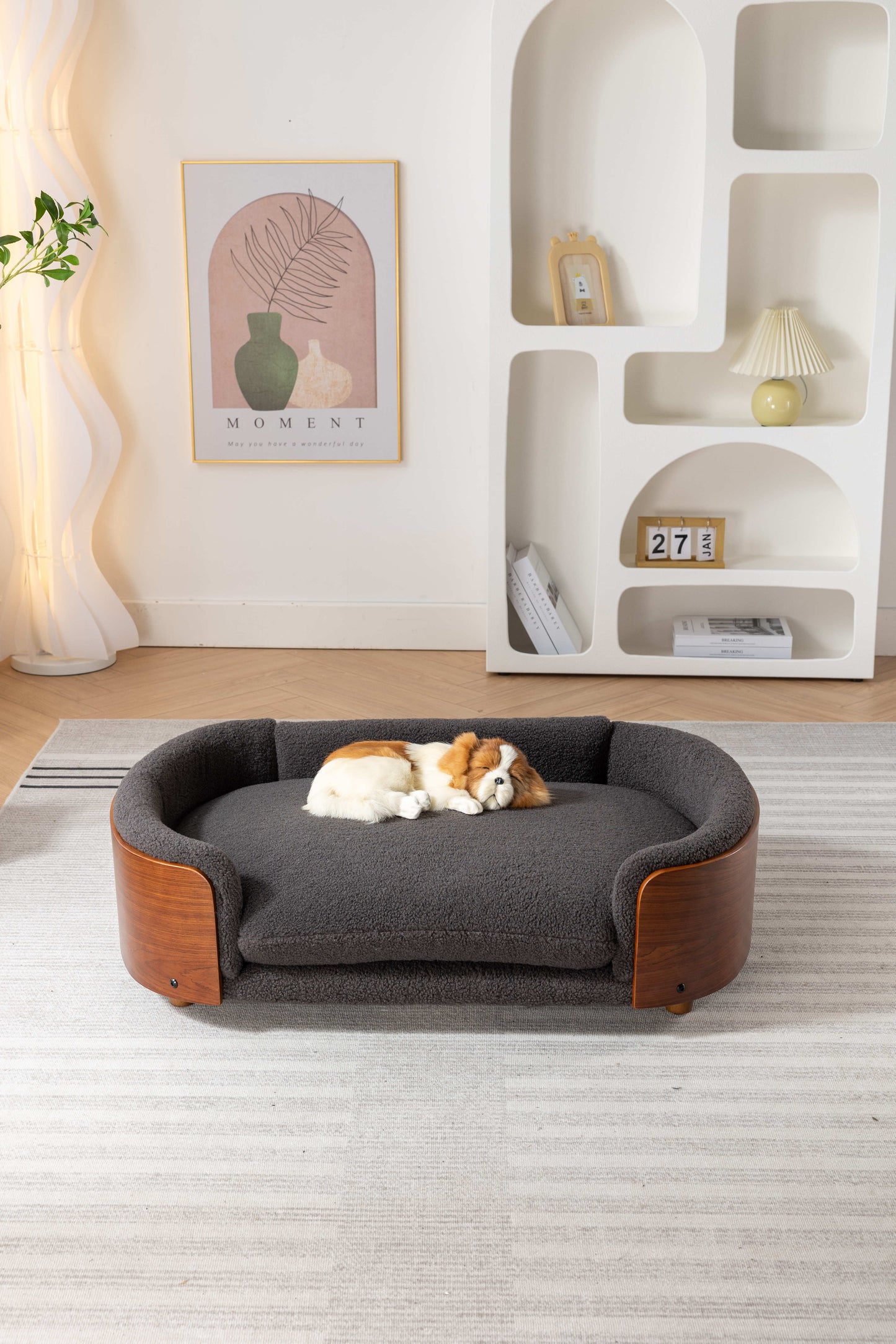 Plush grey dog bed with curved wooden trim and cozy bolster perfect for small pets