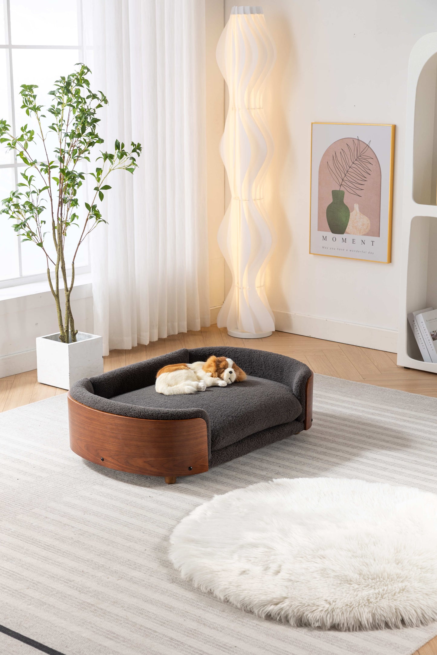 Modern pet bed with dark grey sherpa fabric and curved wood base for stylish comfort