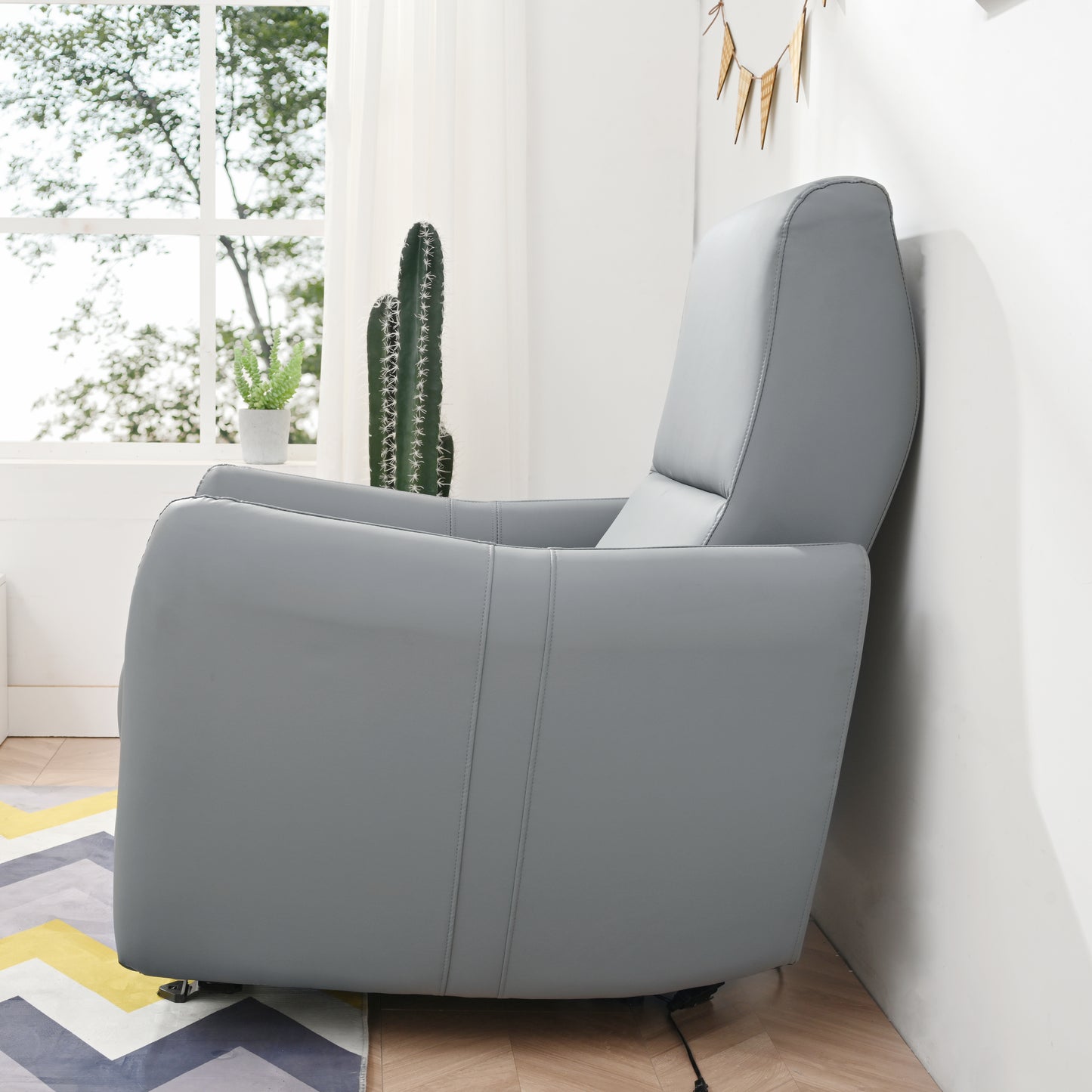 Grey faux leather recliner chair with plush cushioning perfect for living room comfort