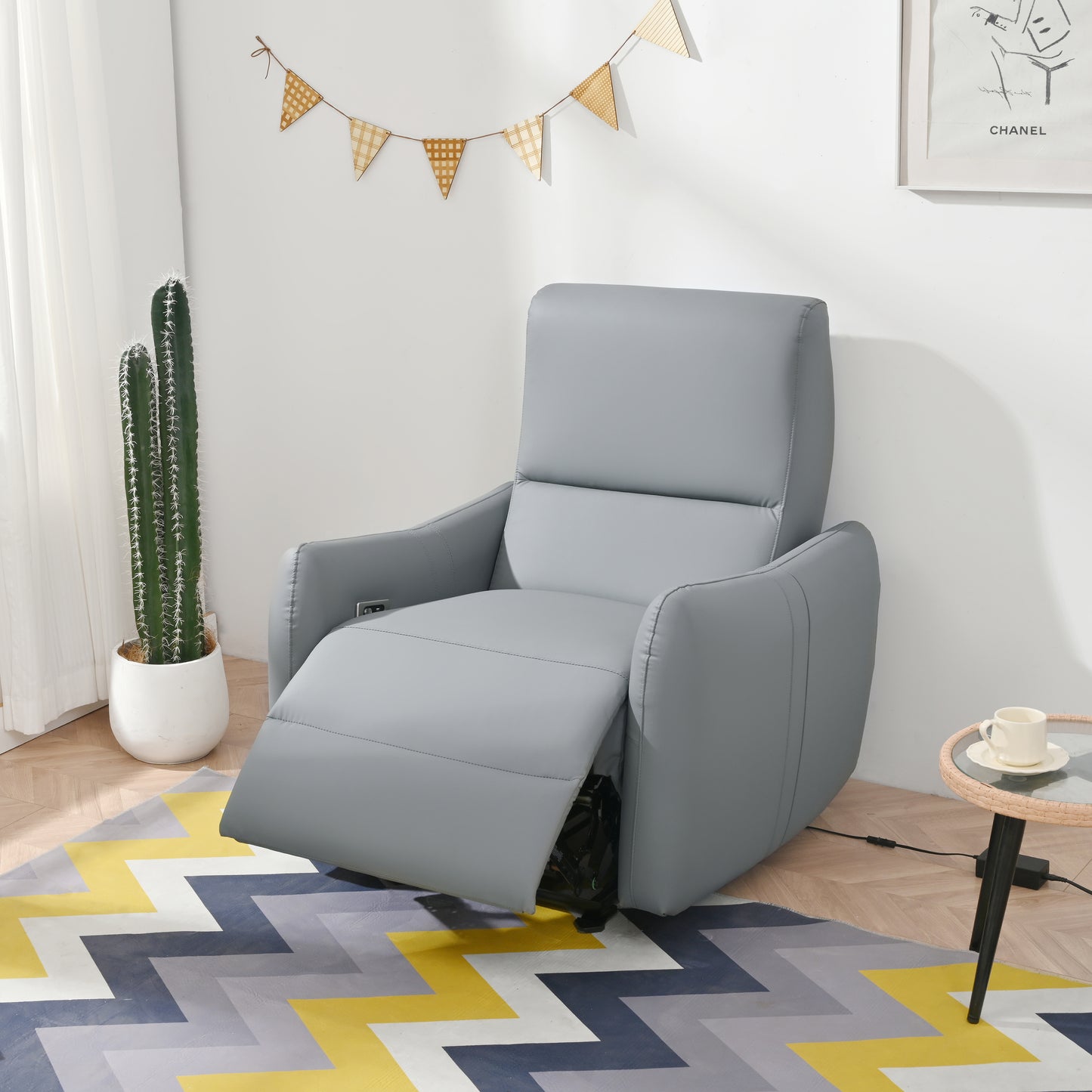 Gray upholstered electric recliner chair with builtin controls for ultimate comfort