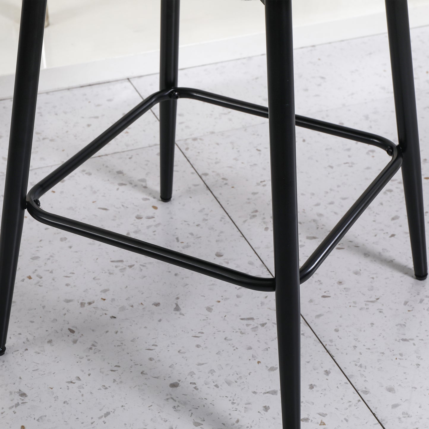 Black metal bar stool base with a square footrest for stability
