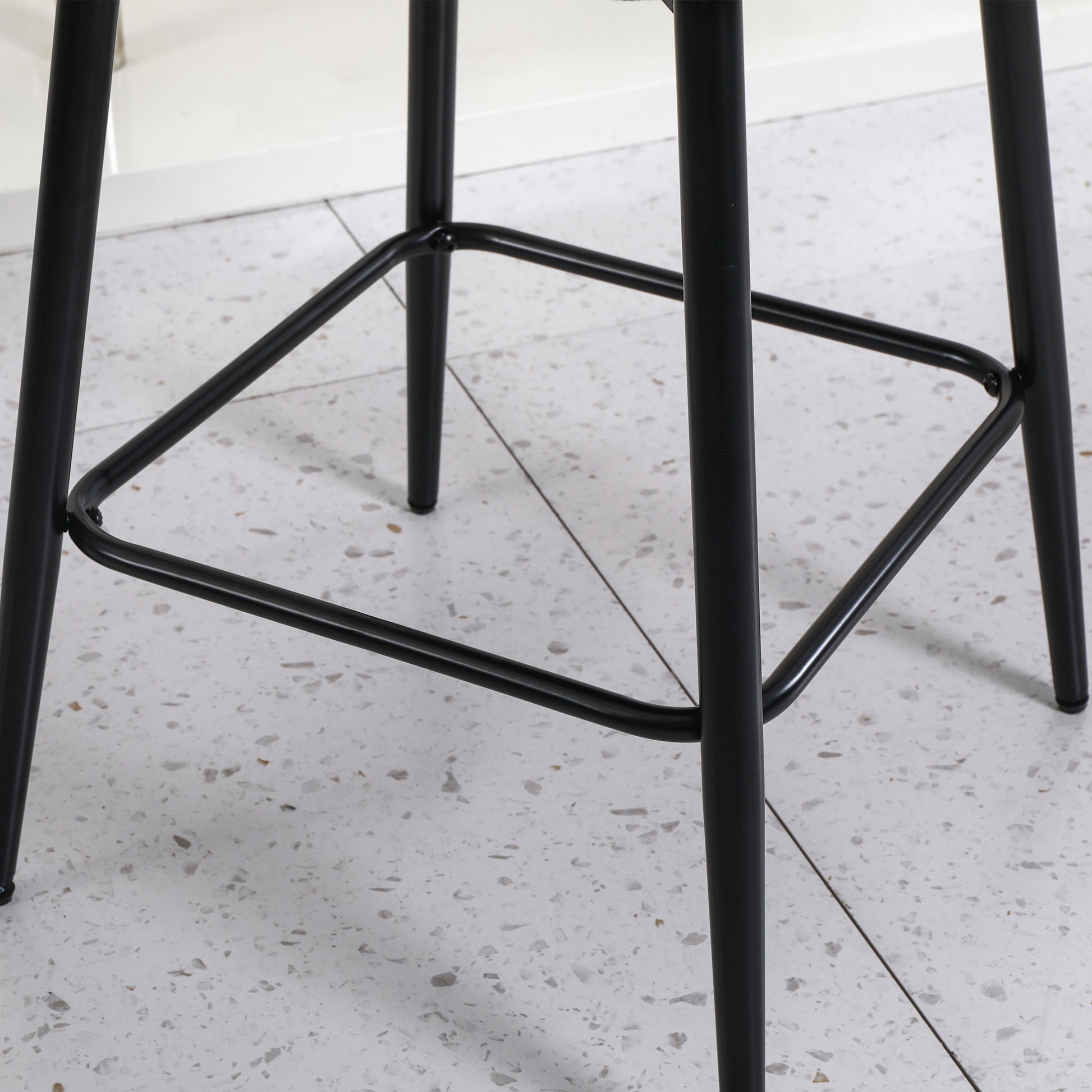 Black metal bar stool base with a square footrest for stability