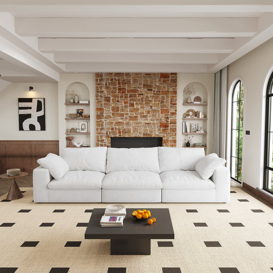 Plush white sectional sofa with deep seats and accent pillows in a modern living room
