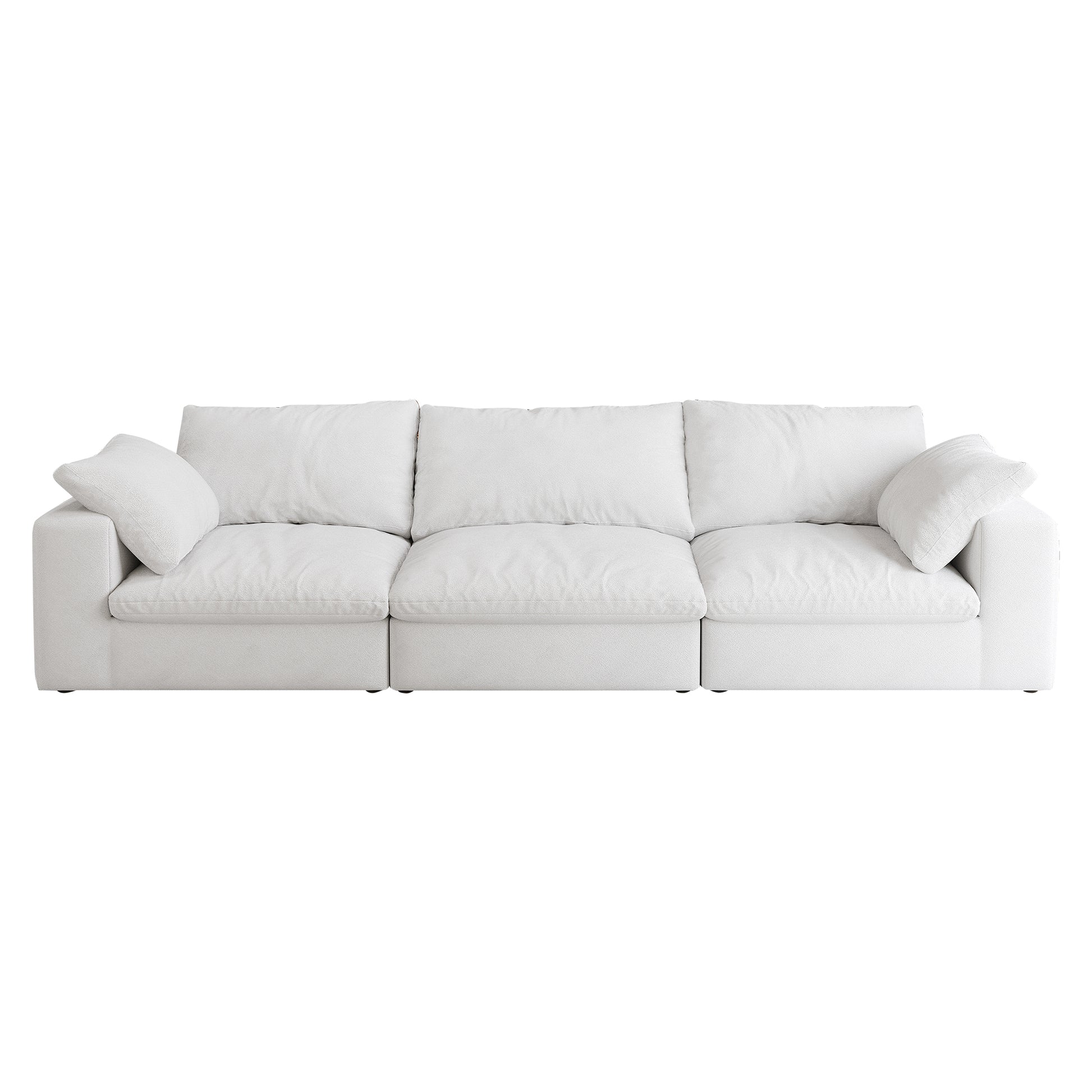 Plush white threeseater sectional sofa with deep seating and loose back pillows for ultimate comfort