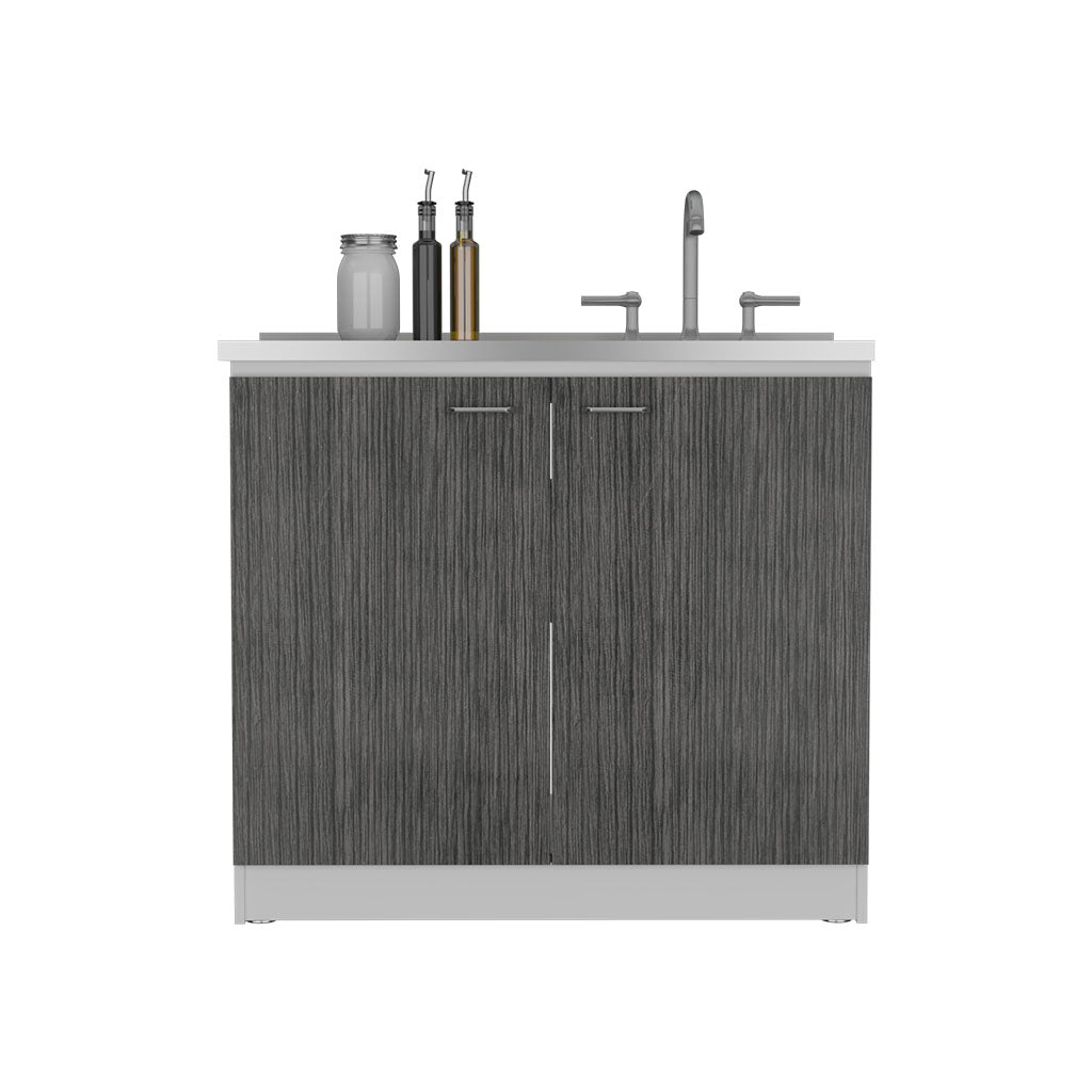 Dark grey wood grain kitchen island cabinet with stainless steel hardware and faucet