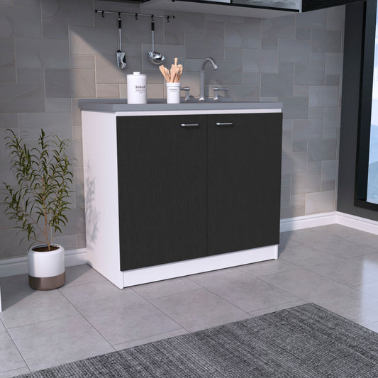 White and dark wood laundry room cabinet with chrome handles and graniteeffect countertop