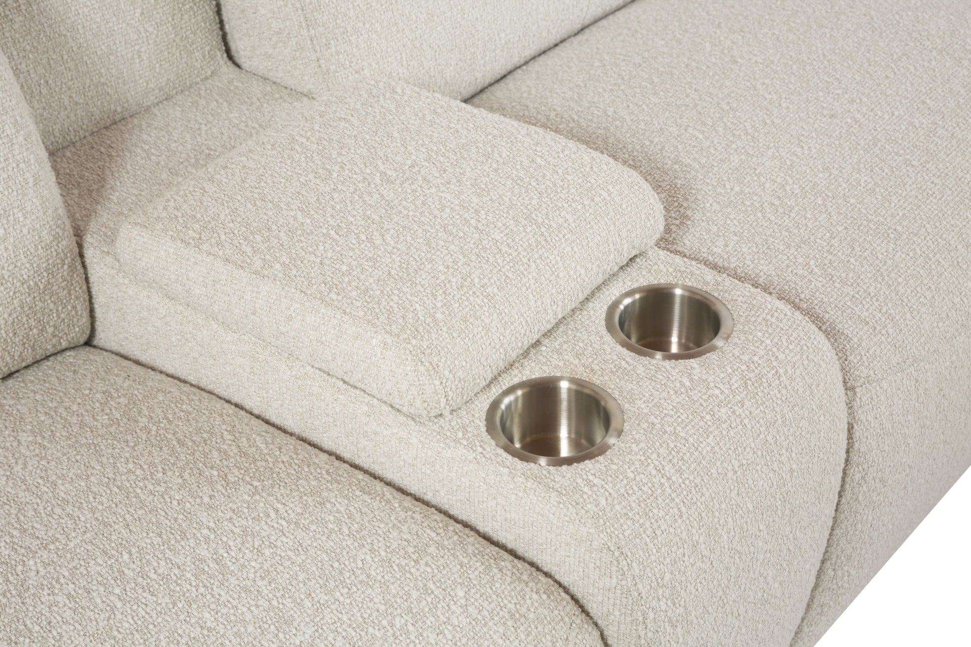 Closeup of beige fabric sofa armrest with two integrated stainless steel cup holders