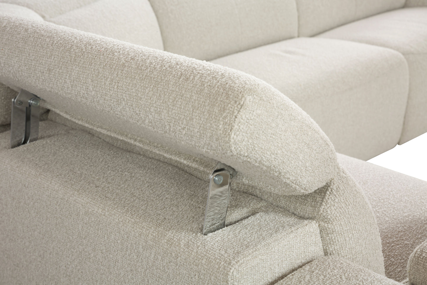 Closeup of a cream boucle sofa armrest with visible stitching detail