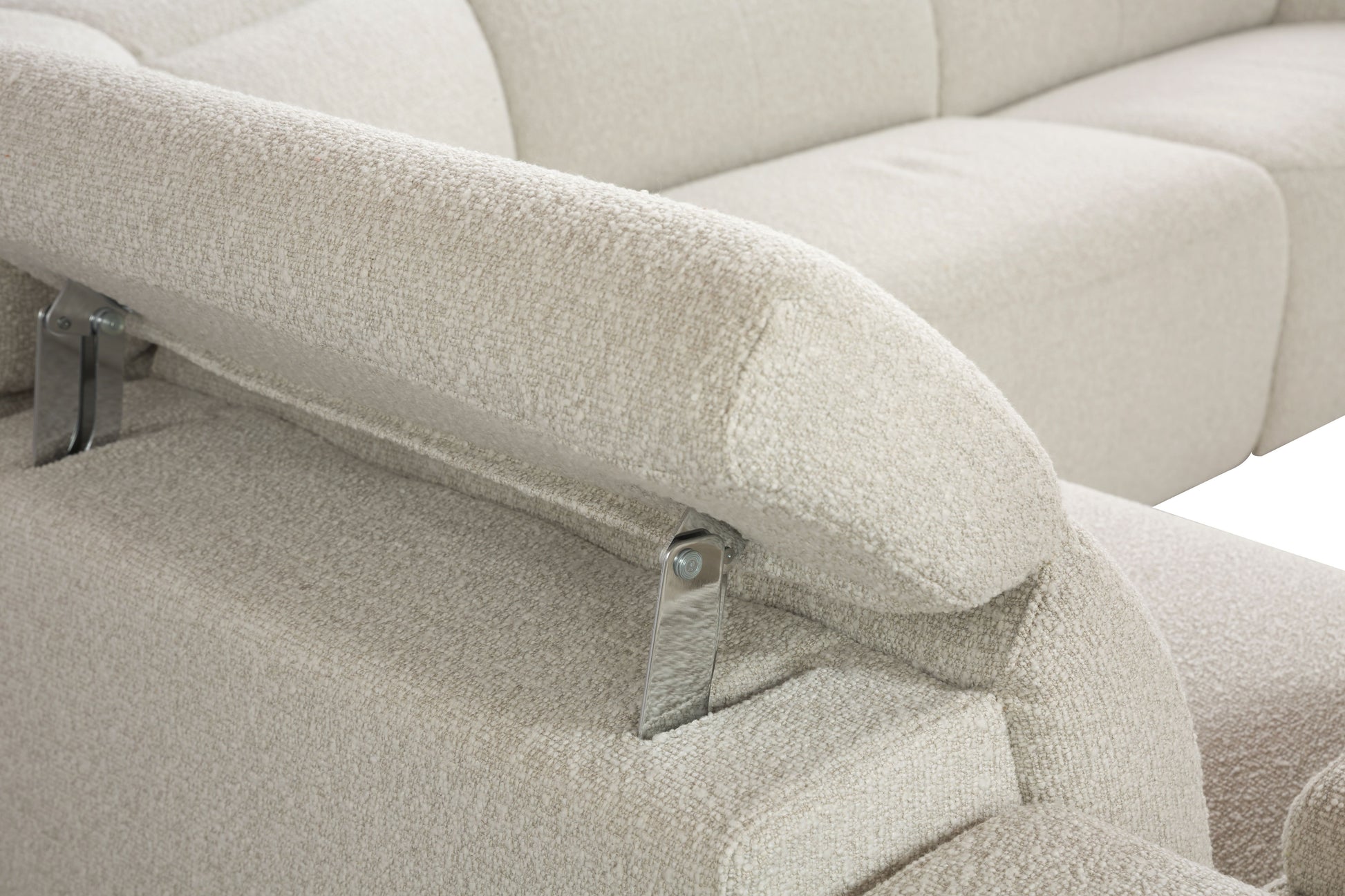 Closeup of a cream boucle sofa armrest with visible stitching detail