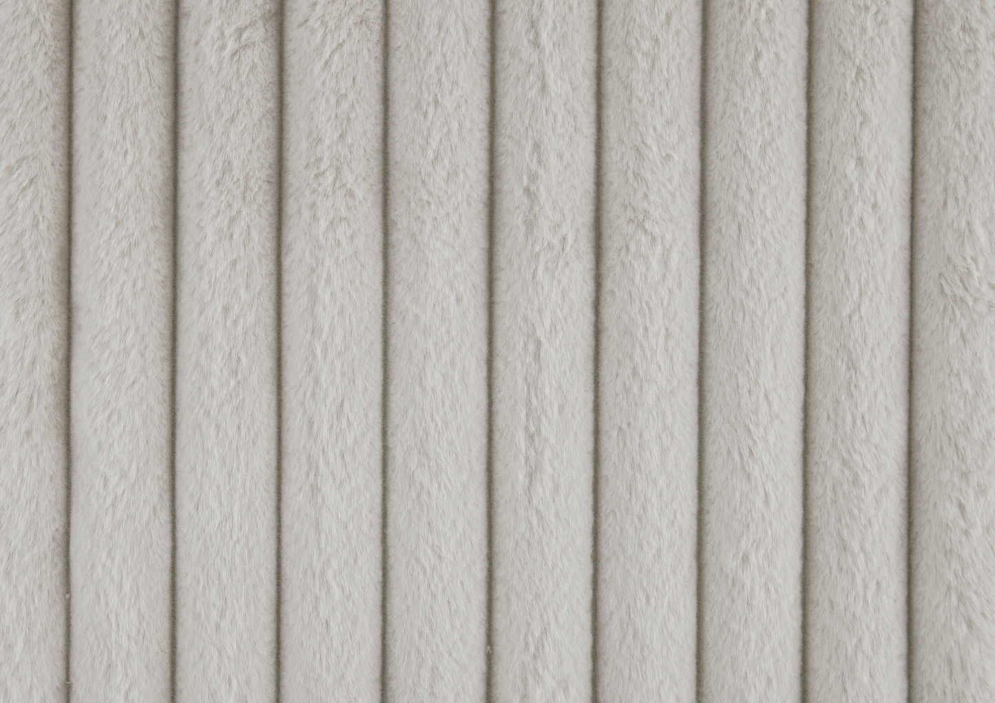 Plush faux fur fabric in a light cream color with vertical ribbing perfect for cozy upholstery