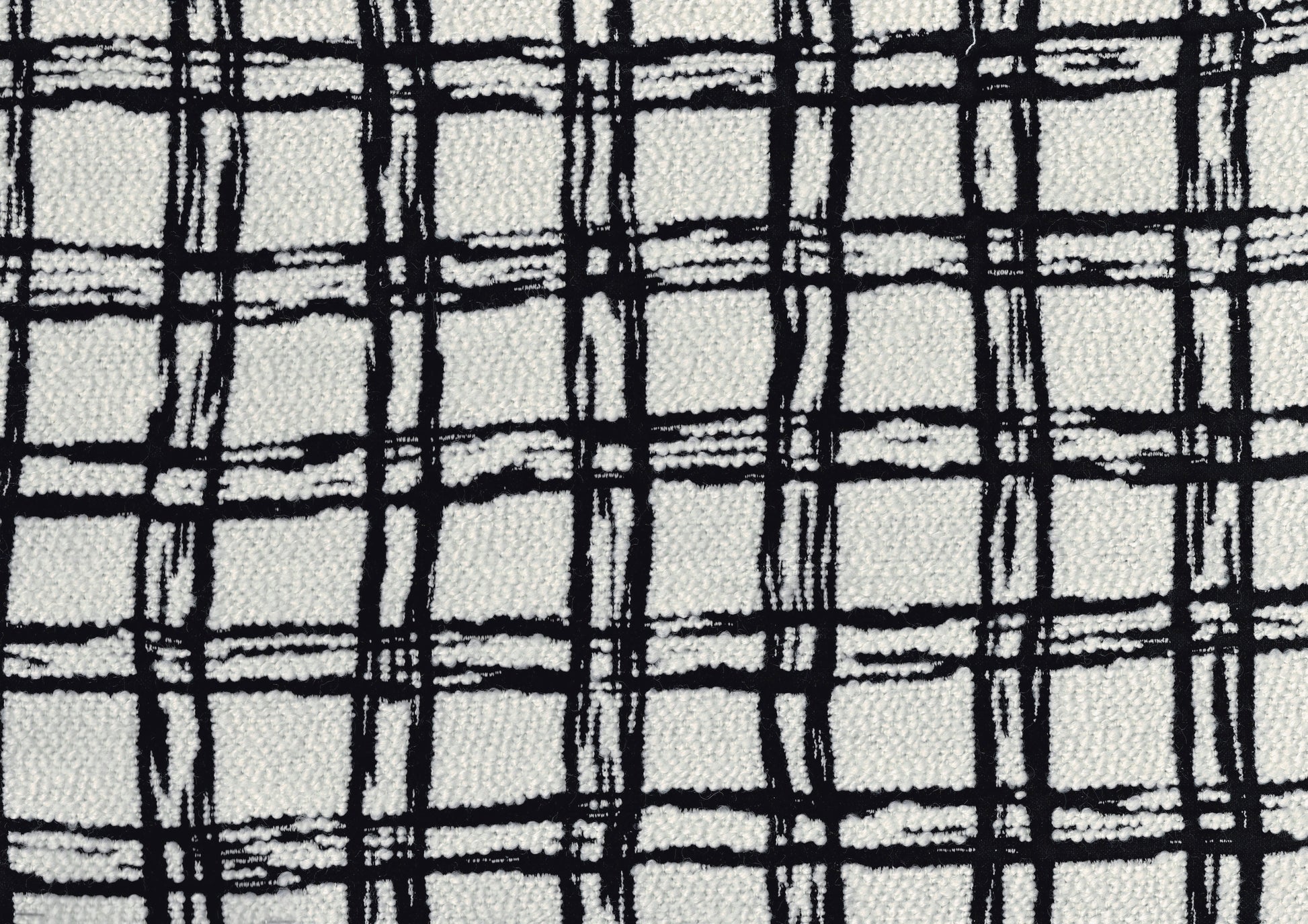 Textured white fabric with a bold black plaid pattern ideal for upholstery