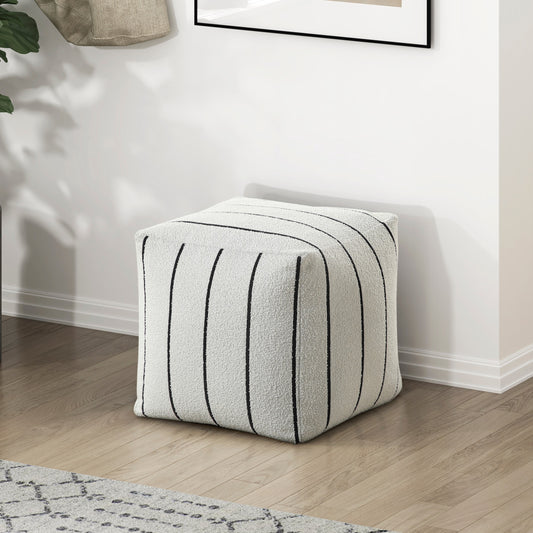 Textured cream cube ottoman with vertical black stripes perfect for a modern living room accent