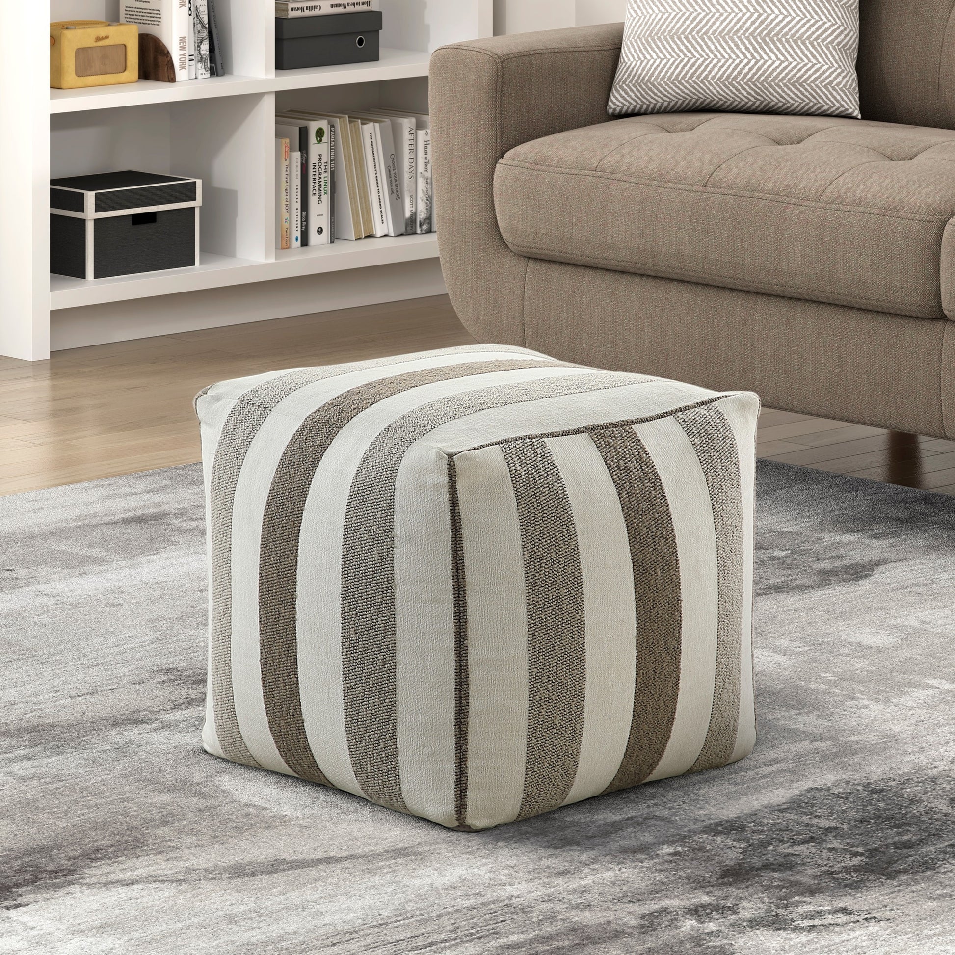 Striped fabric ottoman with neutral tones perfect for living room seating