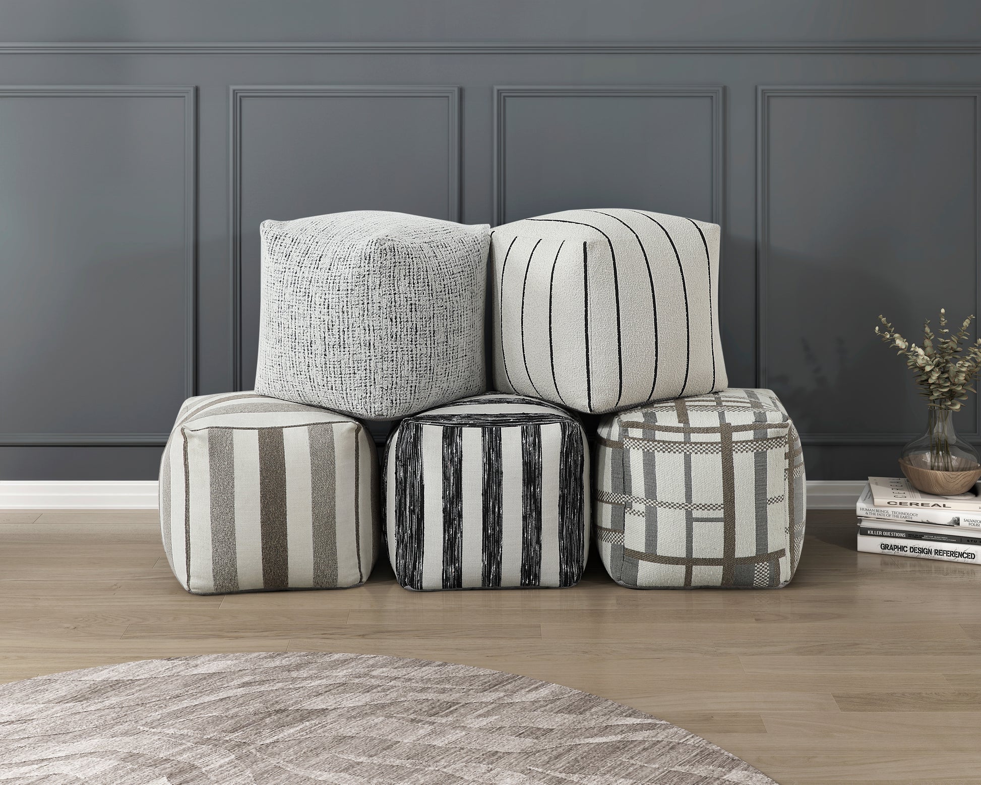 Textured white pouf with subtle black threads perfect for adding comfort to any room