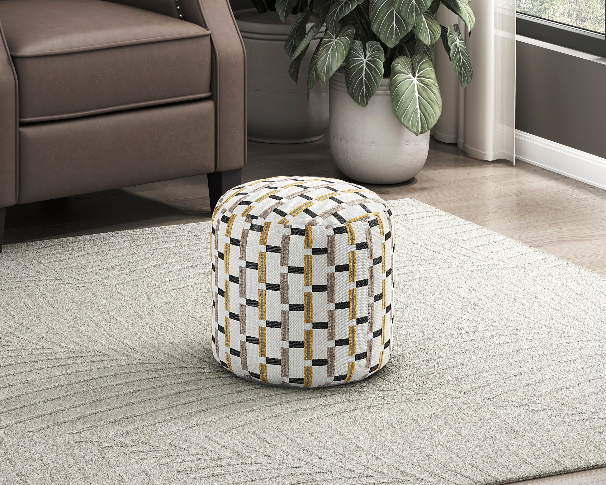 Round fabric ottoman with white gold and black geometric pattern