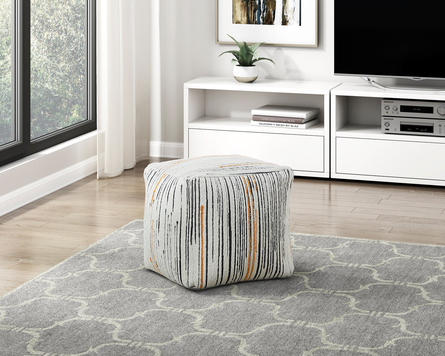 Textured cube ottoman with black and orange vertical stripe pattern