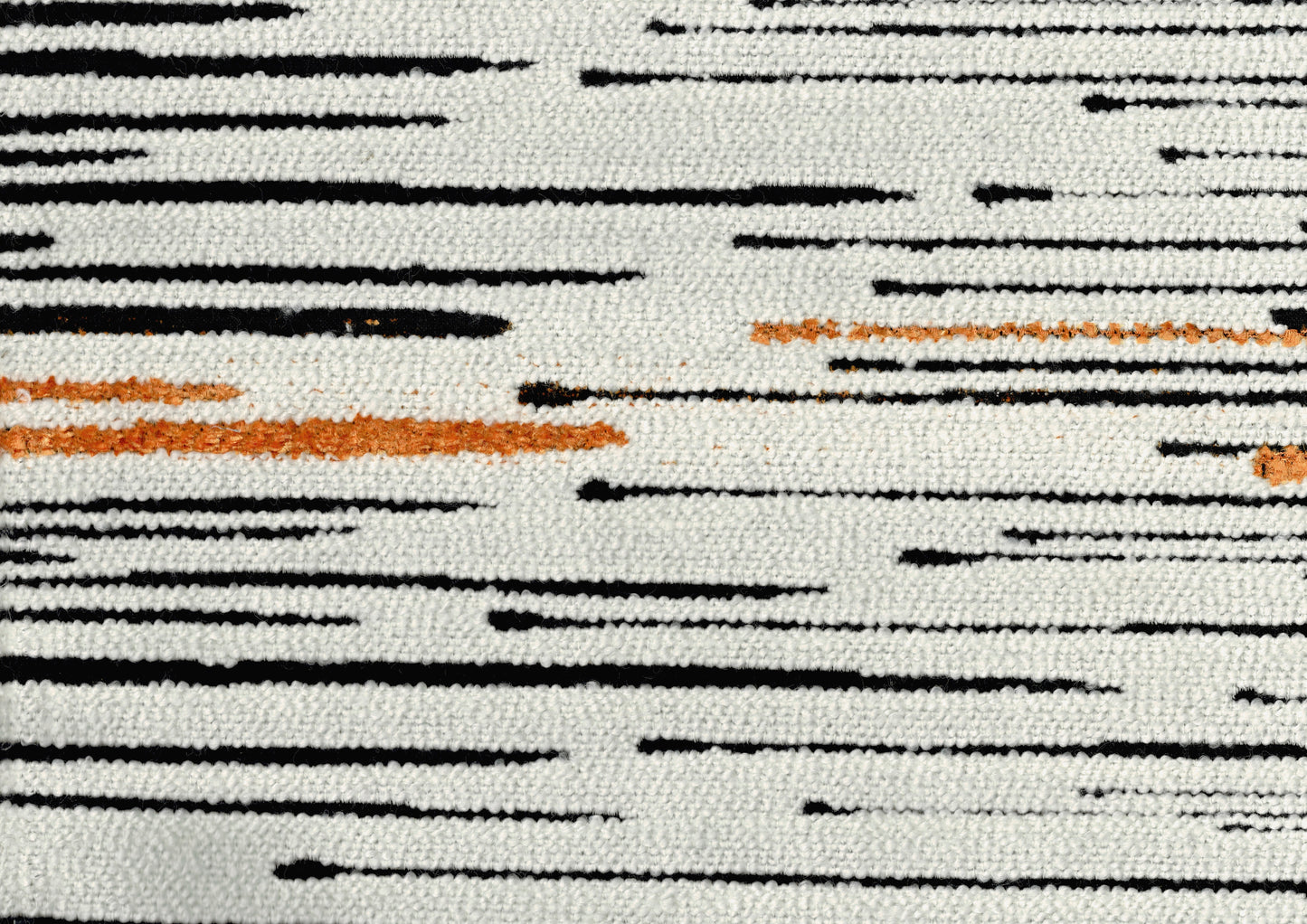 White rug with black abstract lines and occasional orange accents