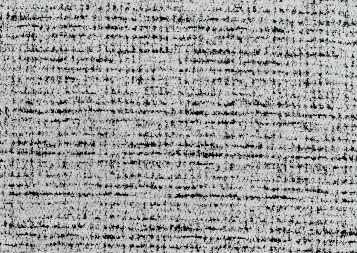 Closeup of textured white and black tweed fabric ideal for upholstery and apparel