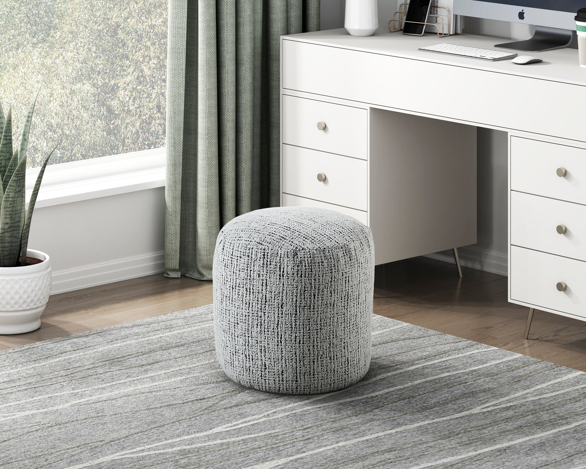 Textured grey fabric ottoman cylindrical shape for versatile seating