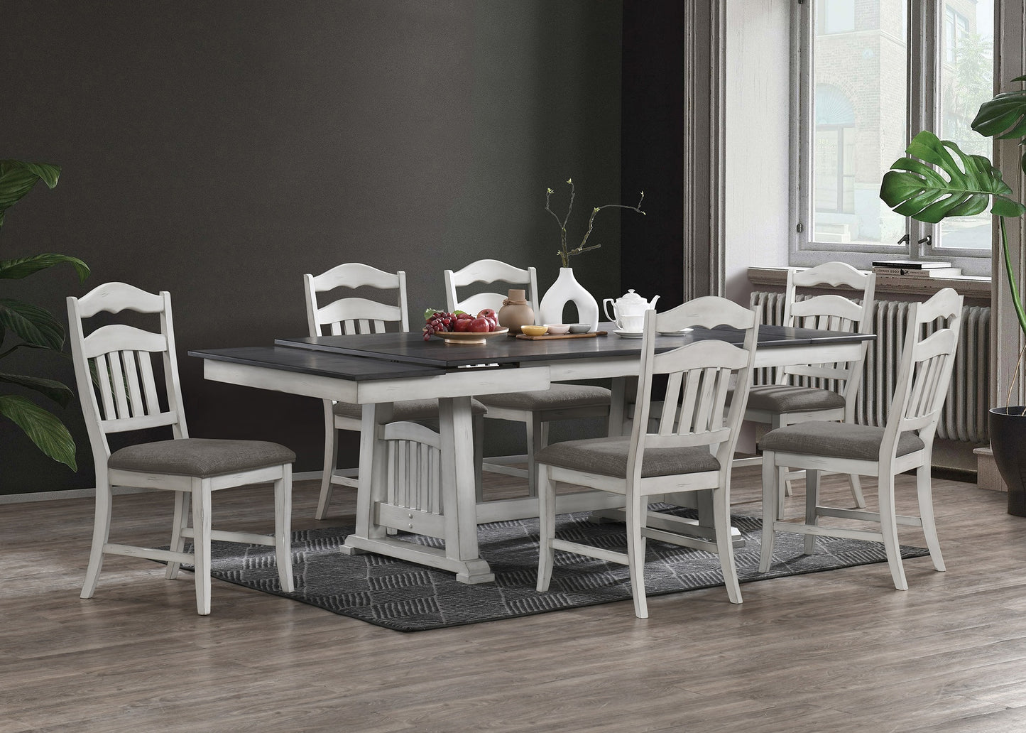 White wooden dining table set with upholstered chairs and dark grey accents