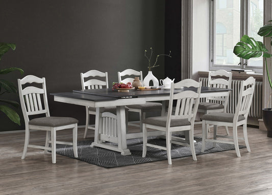 White wooden dining table set with upholstered chairs and dark grey accents