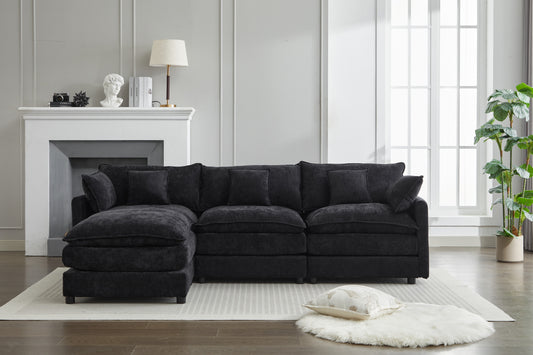 Plush charcoal sectional sofa with deep cushions and reversible chaise for modern living room comfort