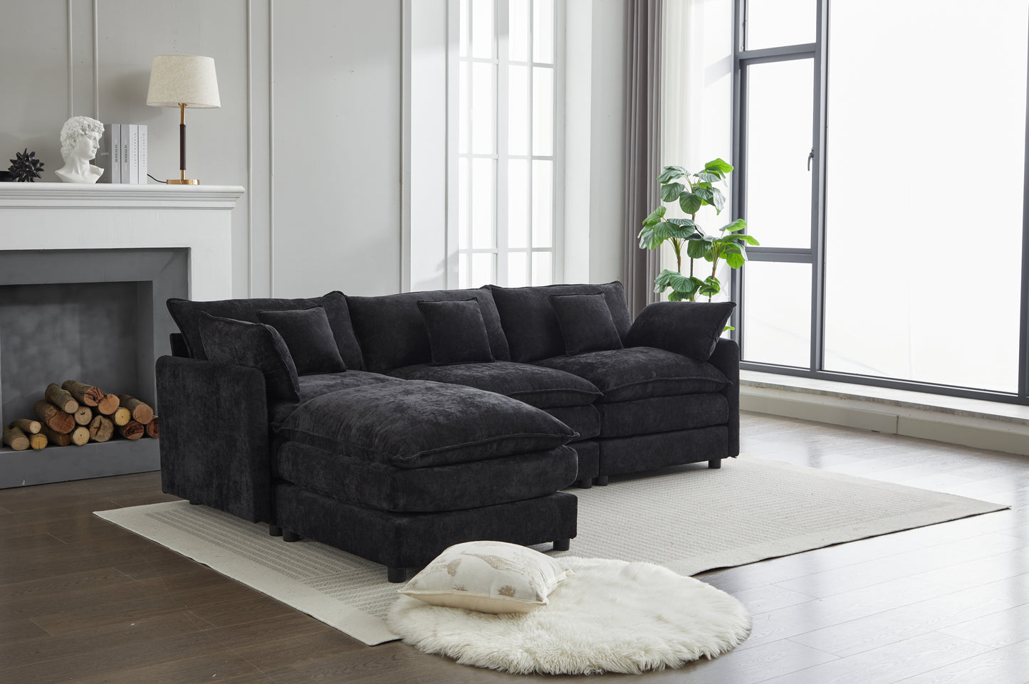 Plush charcoal gray sectional sofa with deep seats and multiple throw pillows