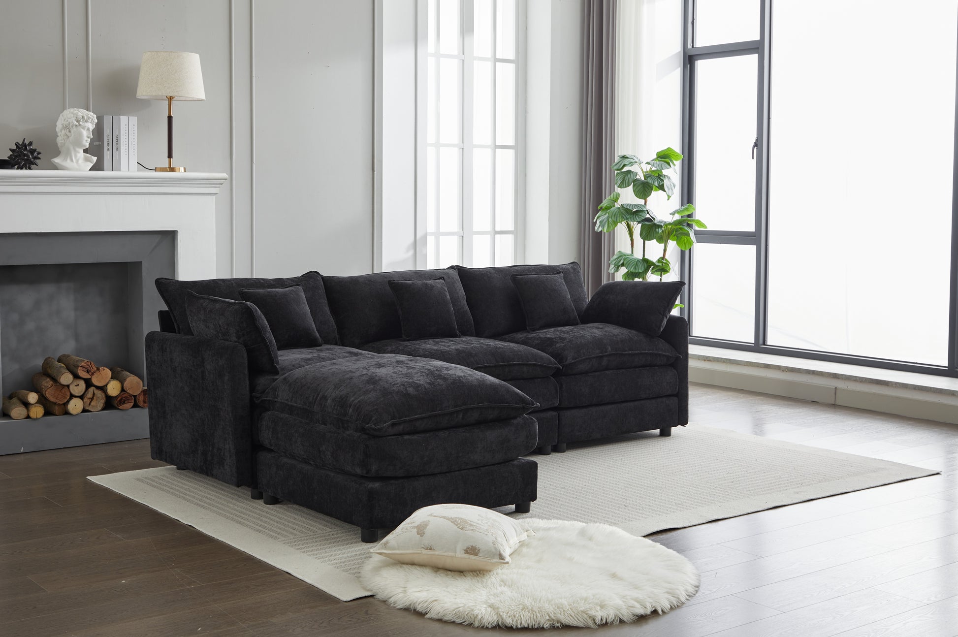 Plush charcoal gray sectional sofa with deep seats and multiple throw pillows