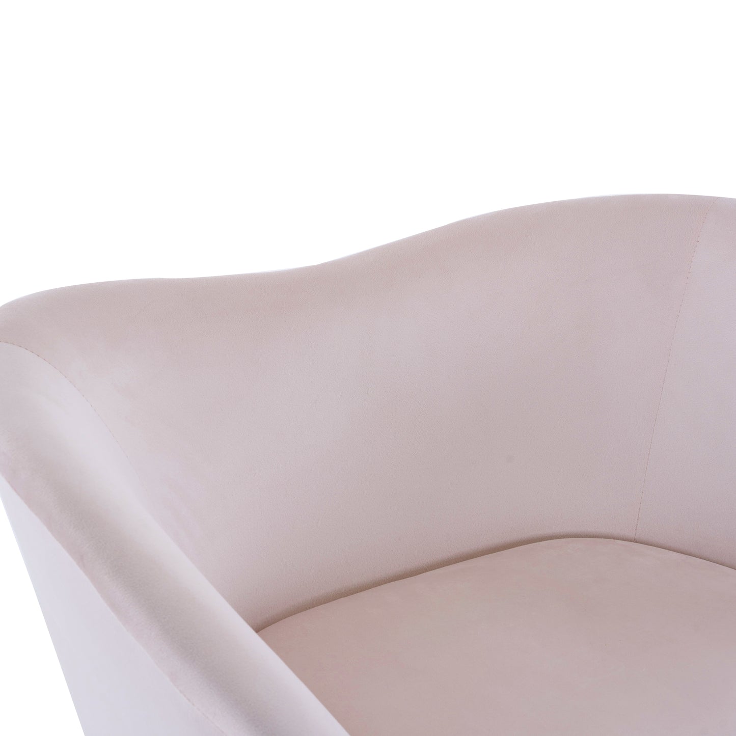 Closeup of a plush velvet accent chair in a soft beige hue