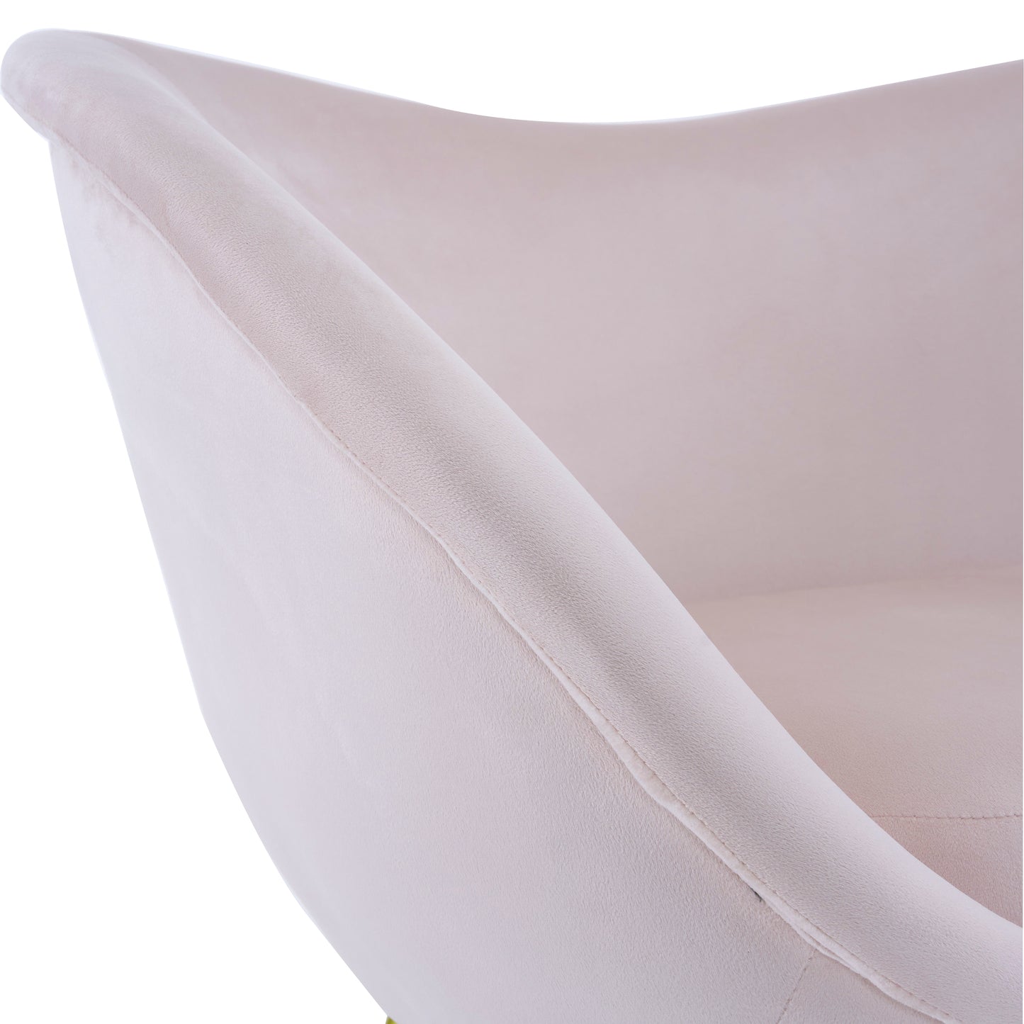 Closeup of a plush blush velvet accent chairs curved armrest