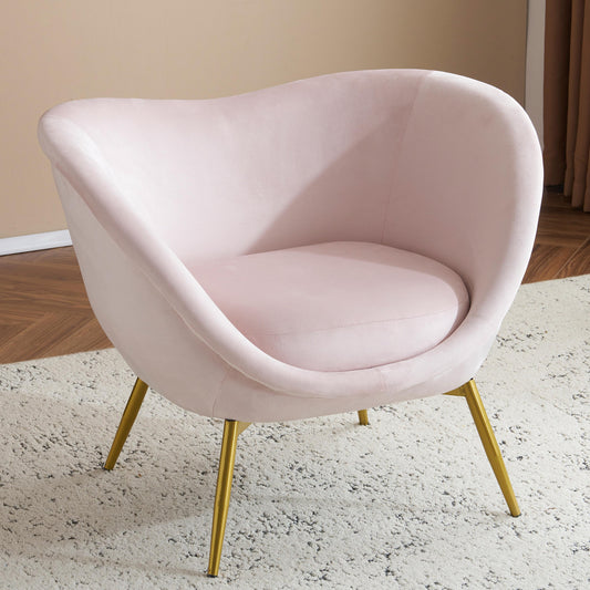 Blush pink velvet accent chair with comfortable curved seat and gold tapered legs