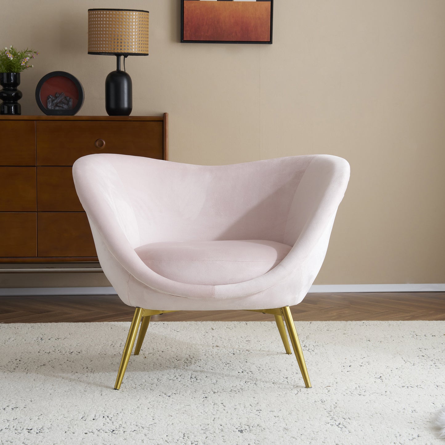Light pink velvet accent chair with gold metal legs perfect for a modern living room