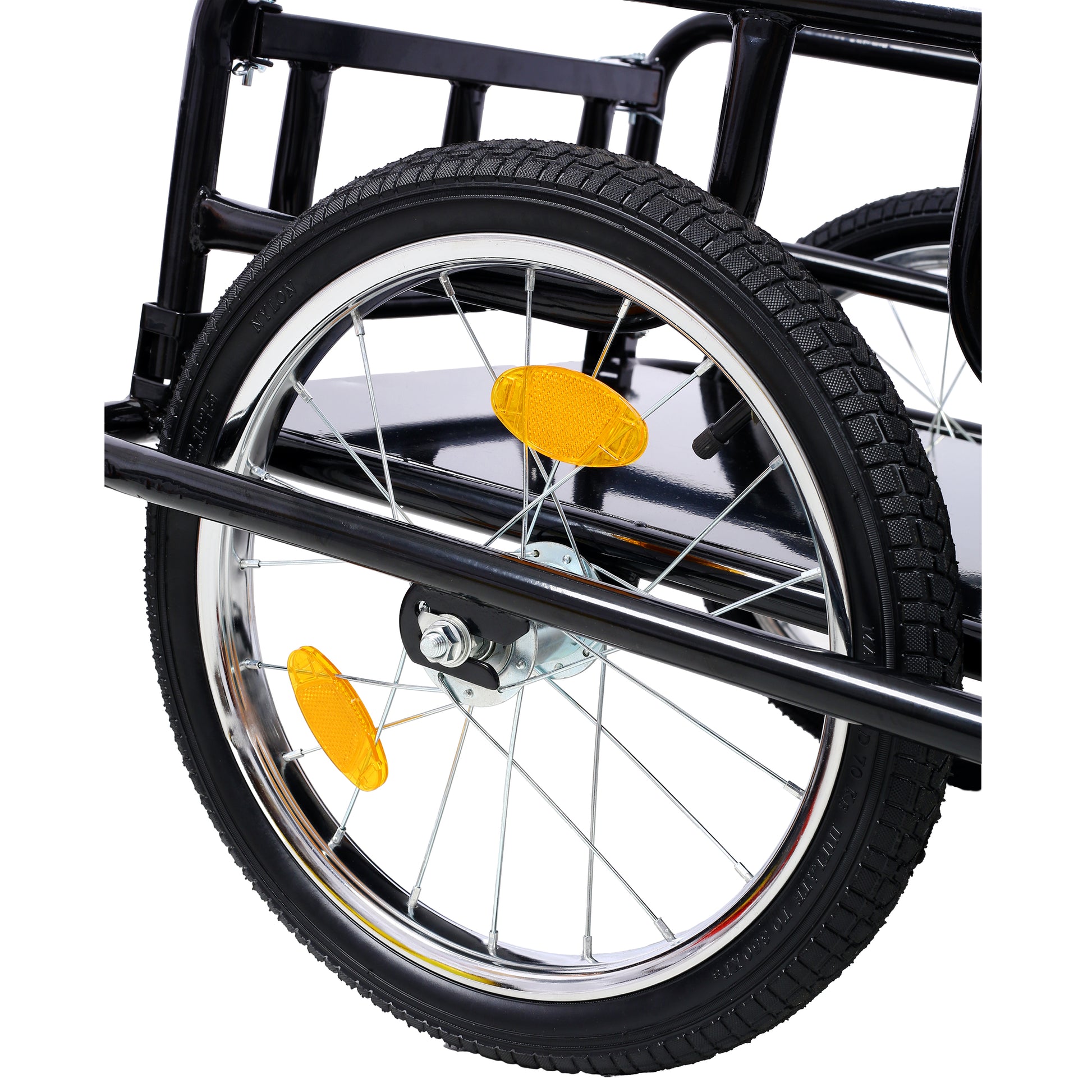 Black steel cargo trailer wheel with reflective orange spoke cover