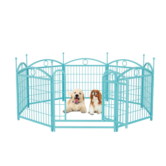 Turquoise metal dog playpen with ornate scrollwork and two puppies inside