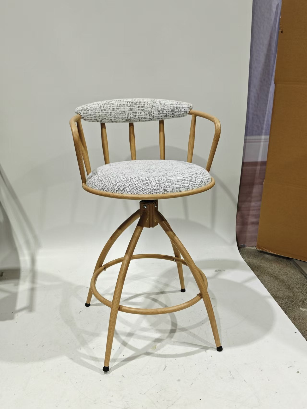 Midcentury modern bar stool with light oak wood frame and grey woven fabric seat and back