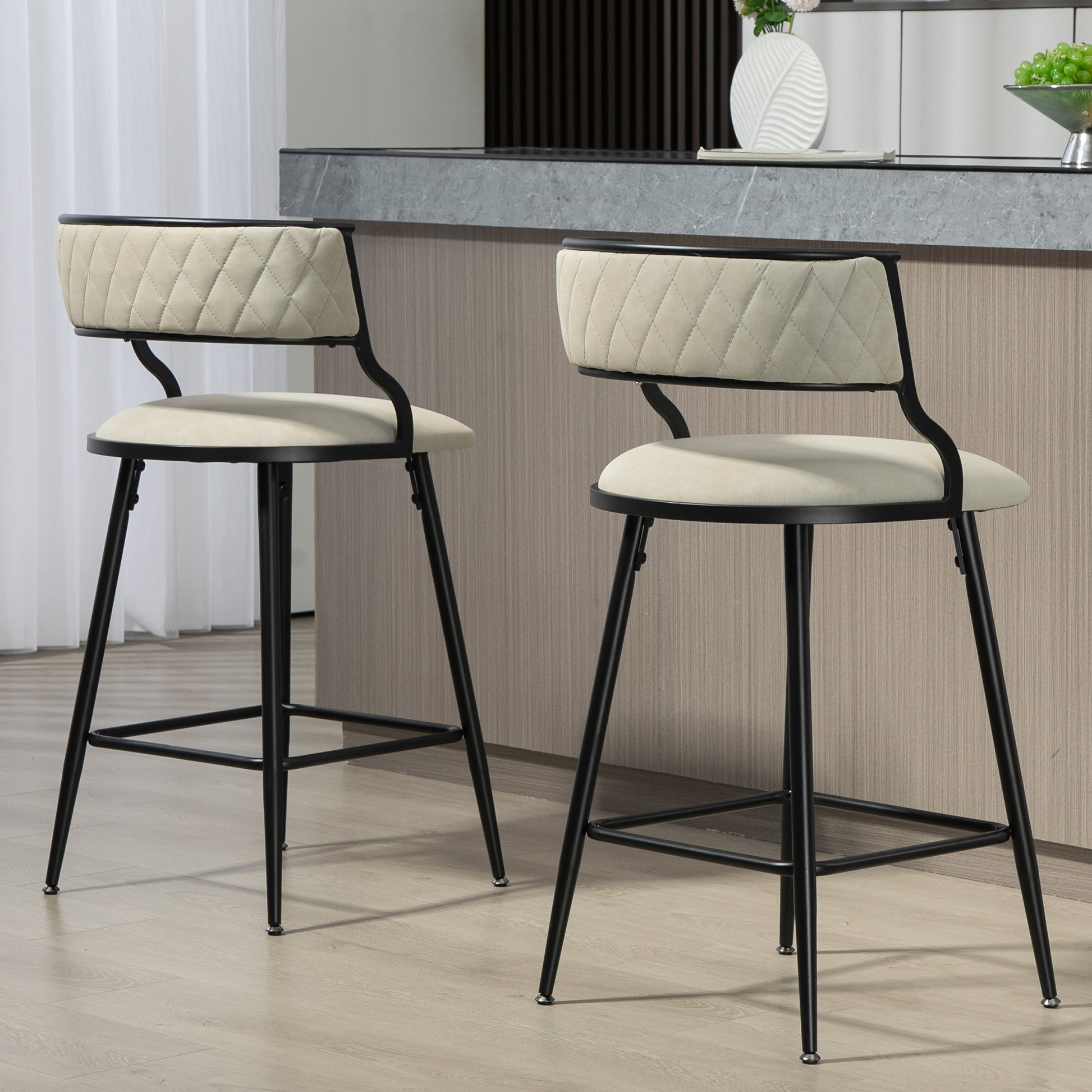 Cream upholstered quilted back bar stool with black metal legs