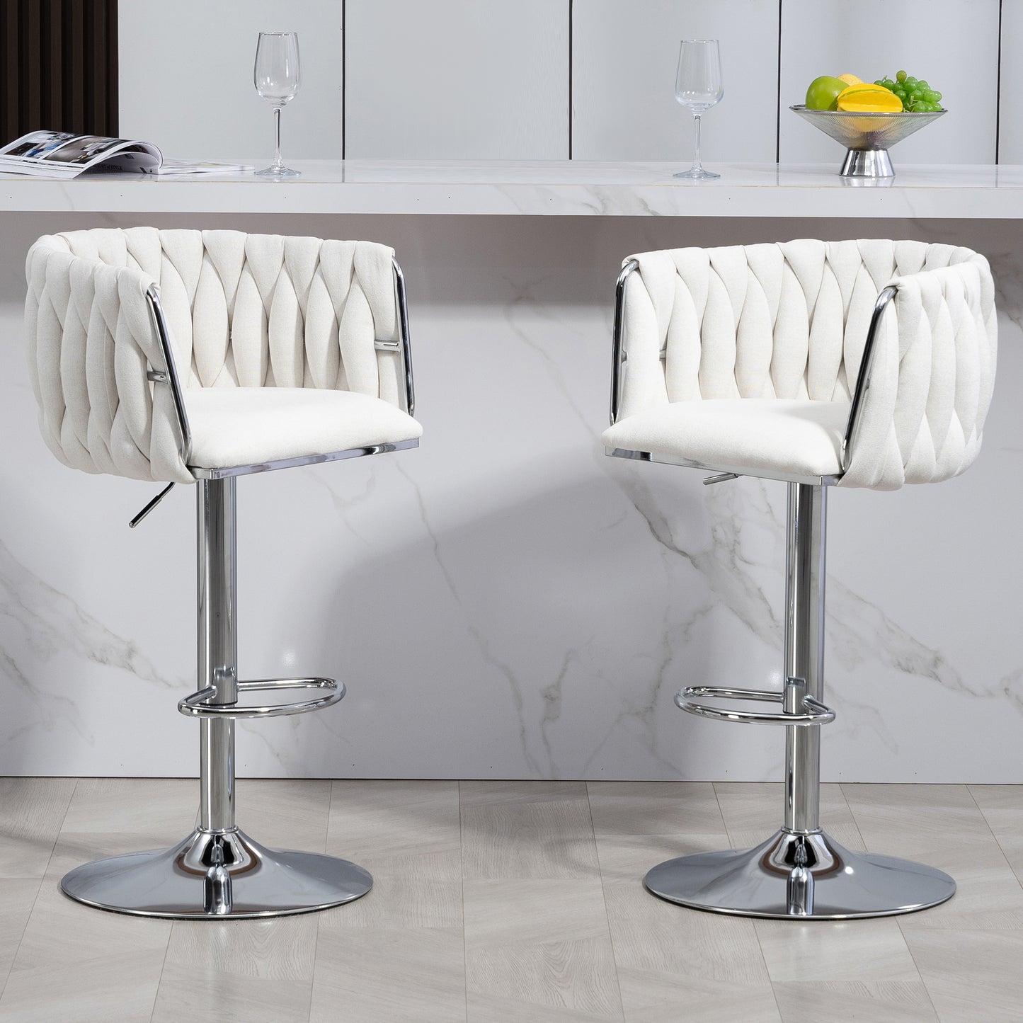 Two white upholstered bar stools with chrome bases featuring tufted diamond patterns on backrests