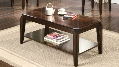 Dark wood coffee table with geometric inlay on top featuring a lower shelf