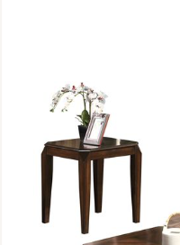 Dark wood end table with carved legs and ornate picture frame a classic accent for living rooms