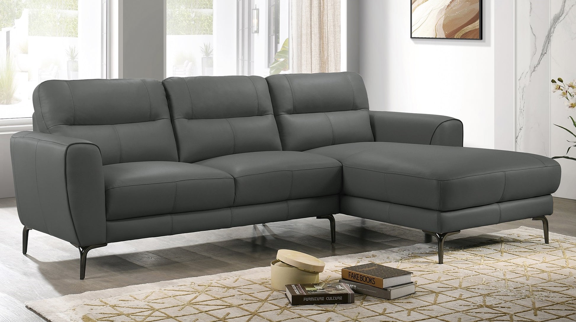 Charcoal gray leather sectional sofa with plush cushions and dark metal legs perfect for modern living rooms