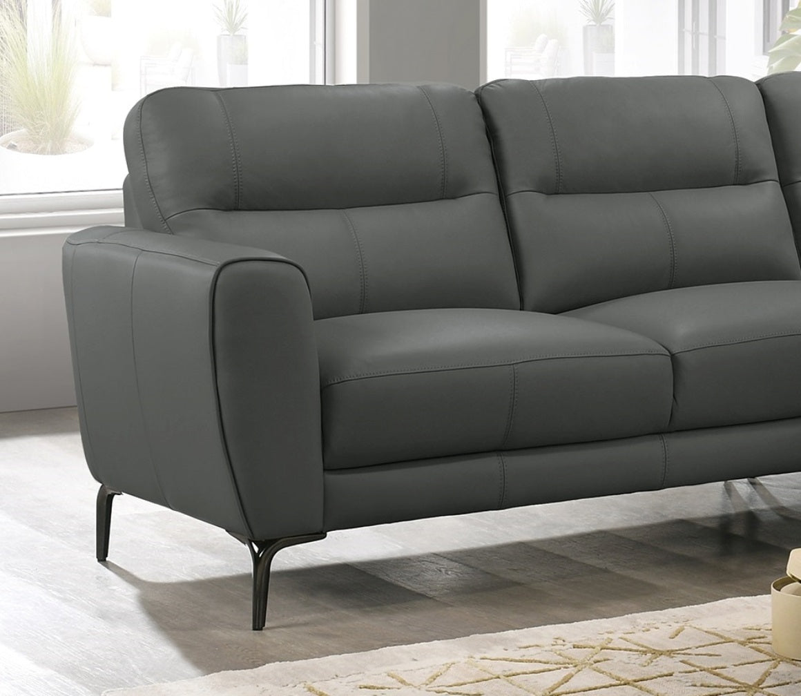 Dark grey leather sectional sofa with clean lines and tapered legs