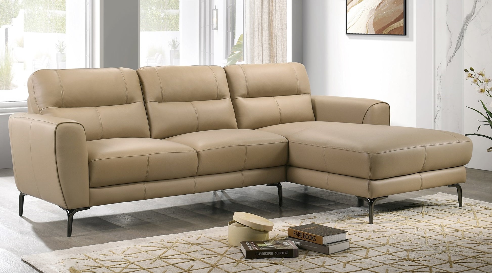 Luxurious beige leather sectional sofa with plush cushions and dark metal legs