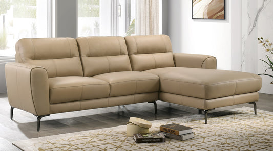 Luxurious beige leather sectional sofa with plush cushions and dark metal legs