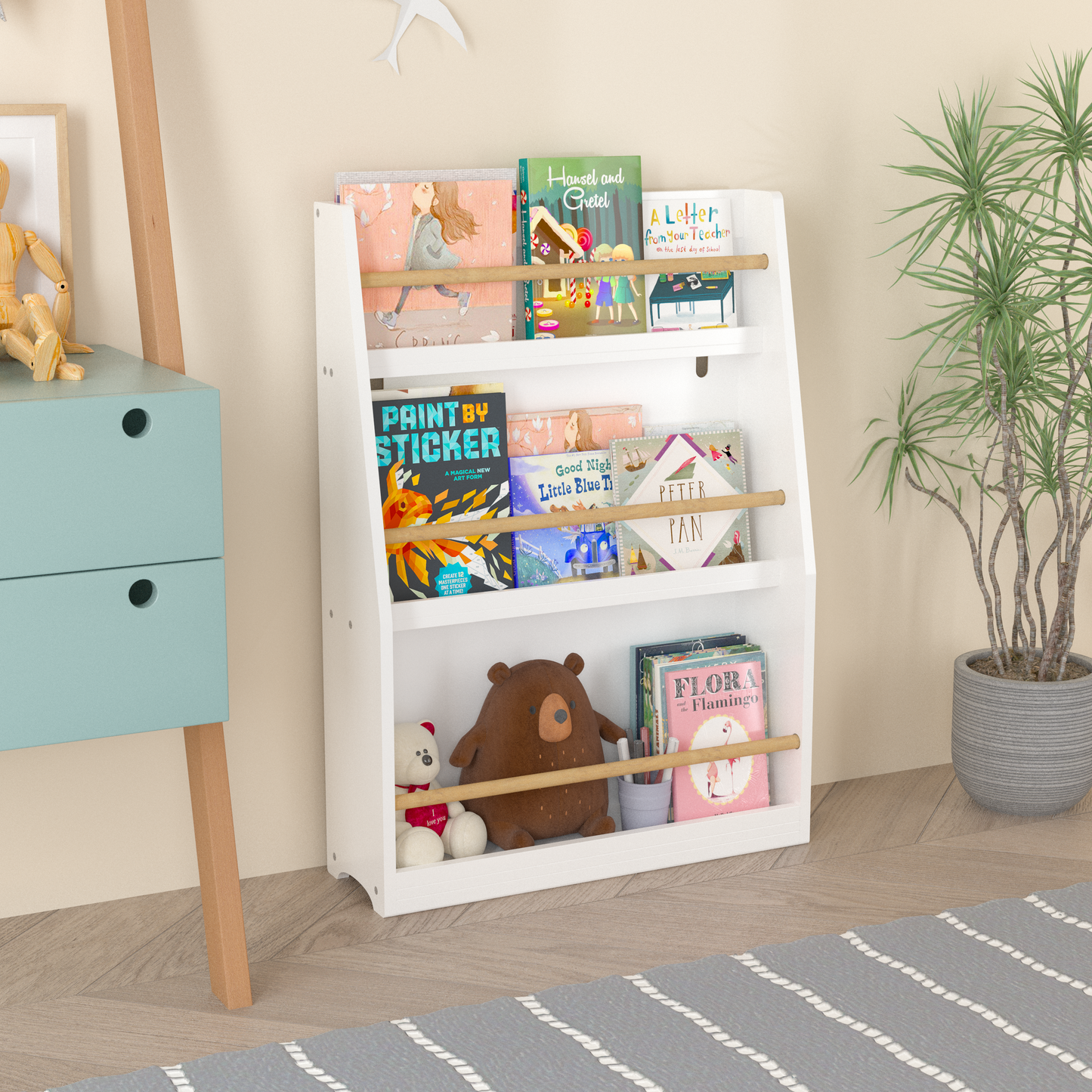 White wooden childrens bookshelf with assorted storybooks and stuffed animals