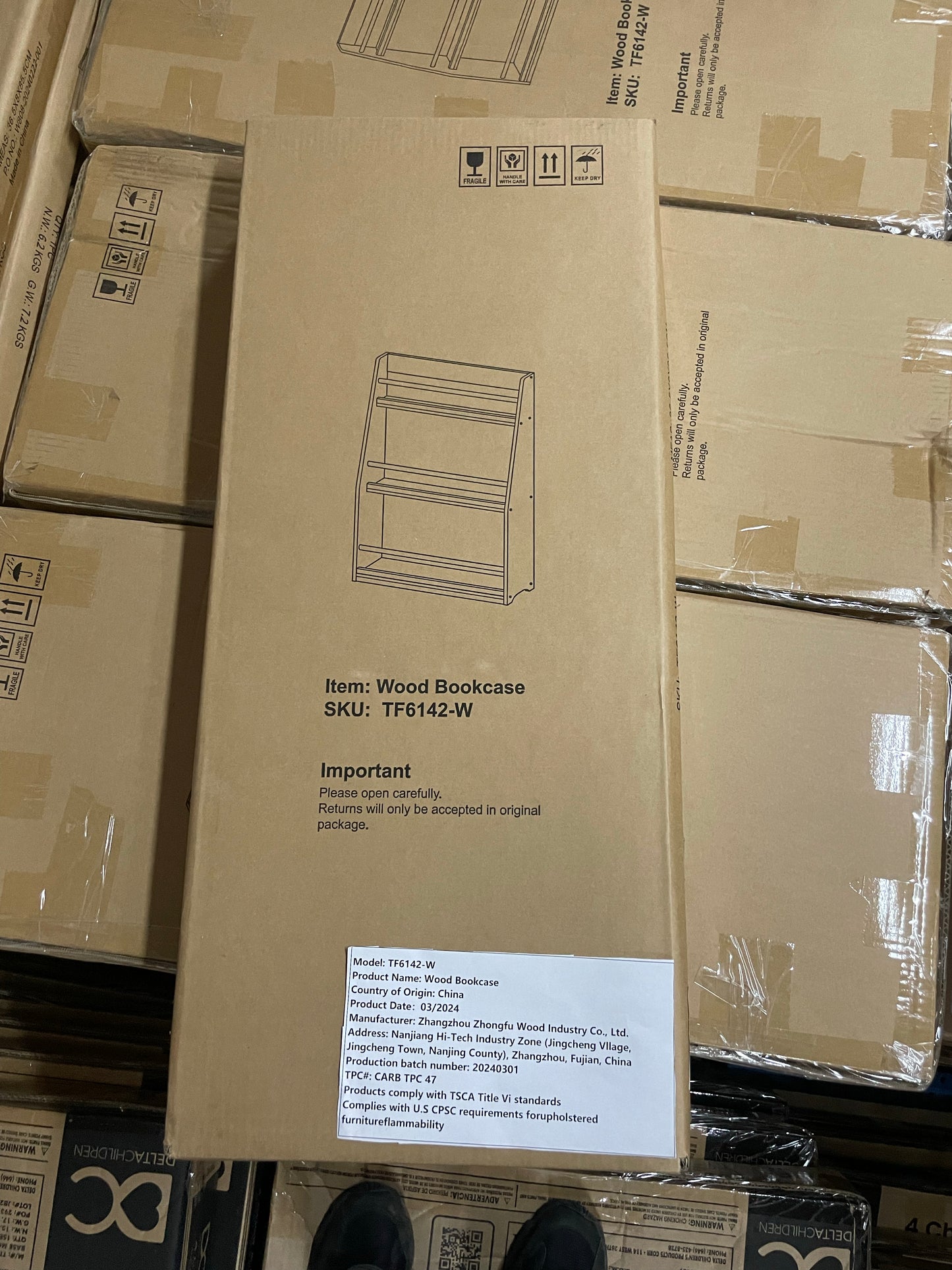 Cardboard box for a wood bookcase SKU TFW with shipping labels