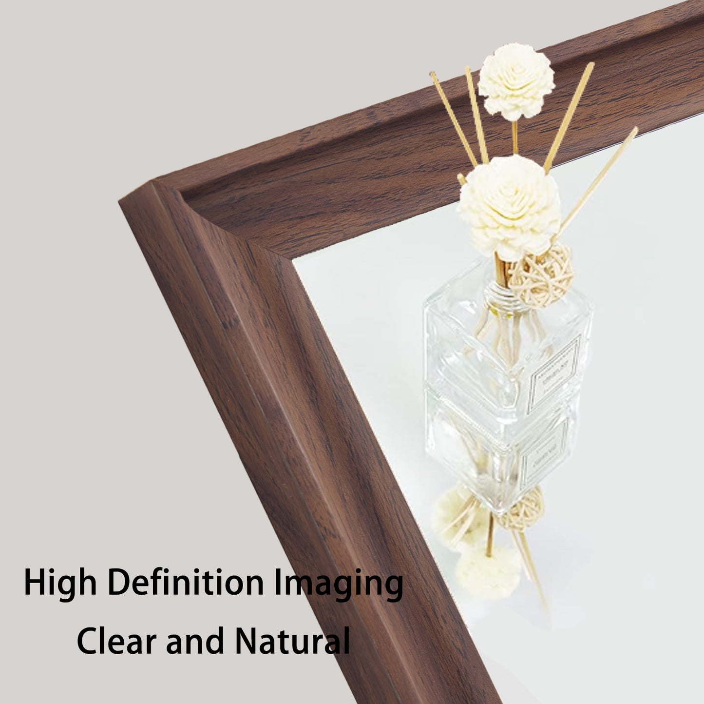 Dark wood textured mirror frame with a decorative diffuser bottle