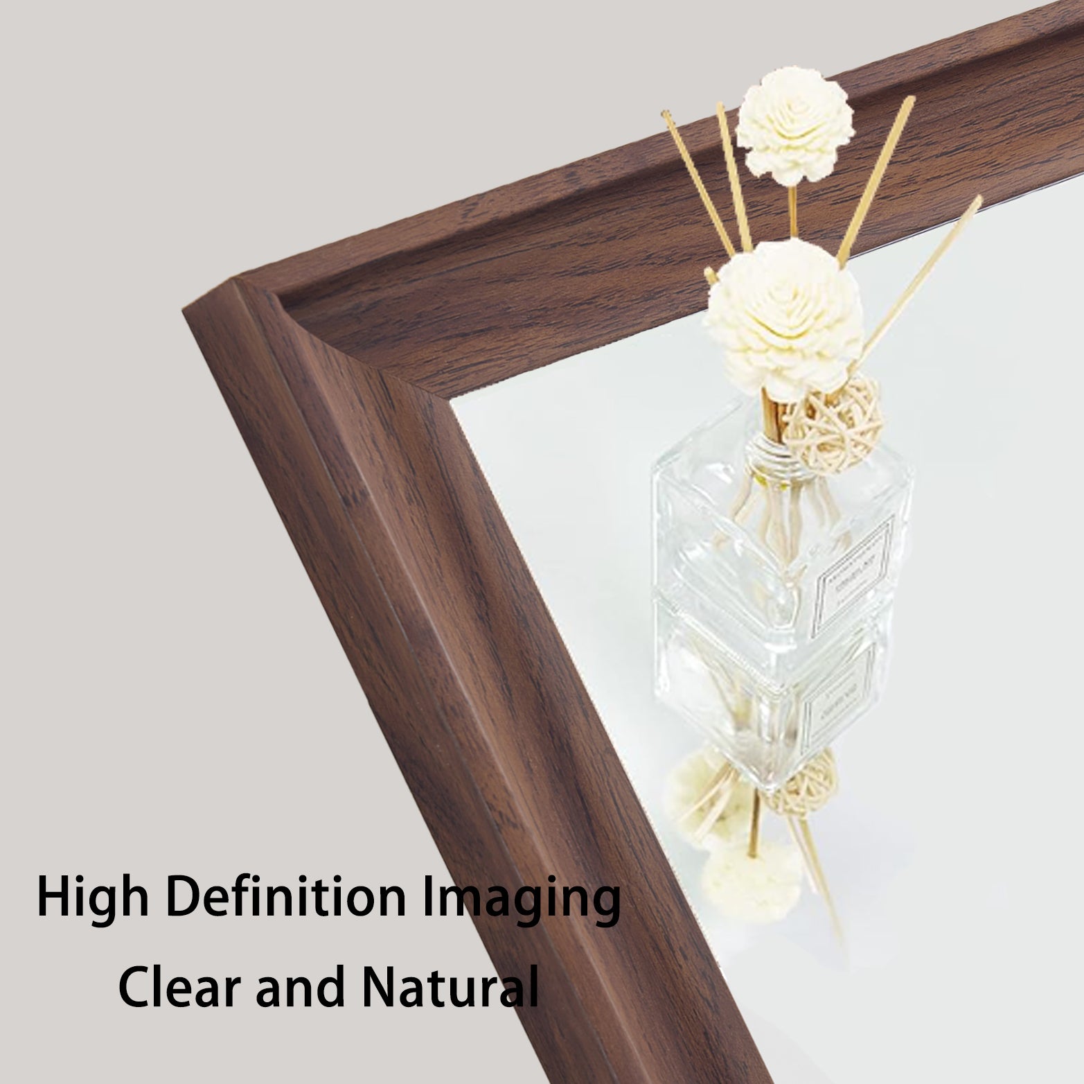 Dark wood textured mirror frame with a decorative diffuser bottle