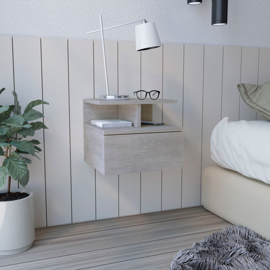 Floating bedside table in light gray wood finish with open shelf and drawer