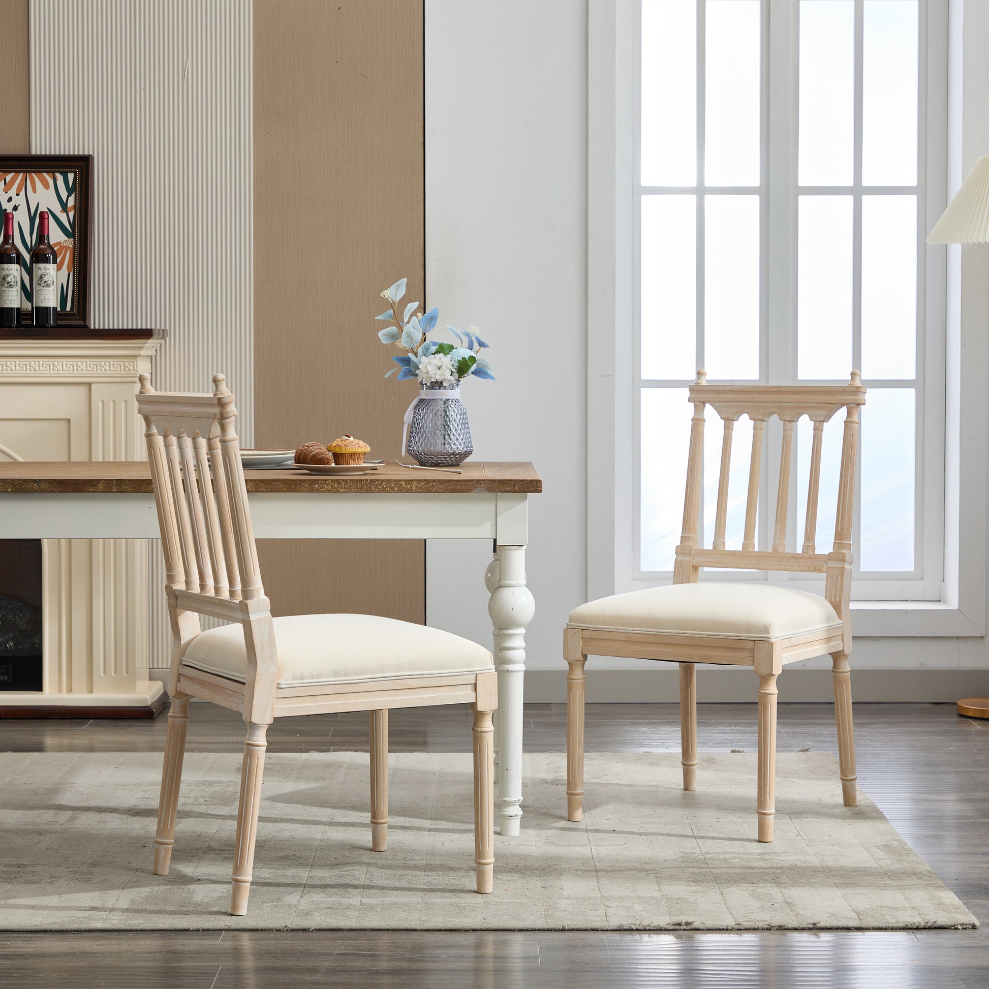 Light oak dining chair with carved legs and cream upholstered seat
