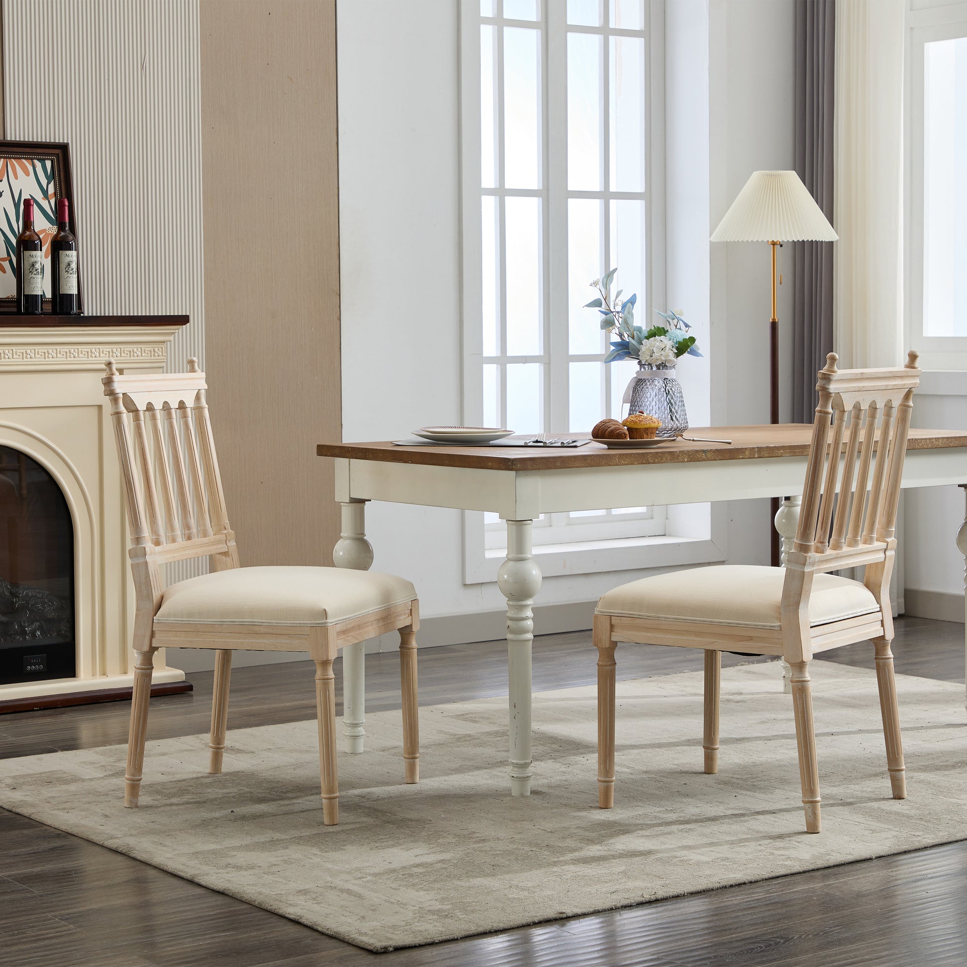 Two natural wood dining chairs with cream upholstery for a refined dining room